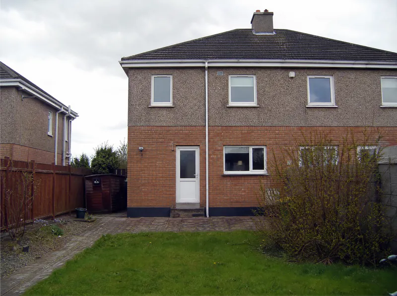 Before: plain rear elevation of a 1980s semi-detached house in Dublin