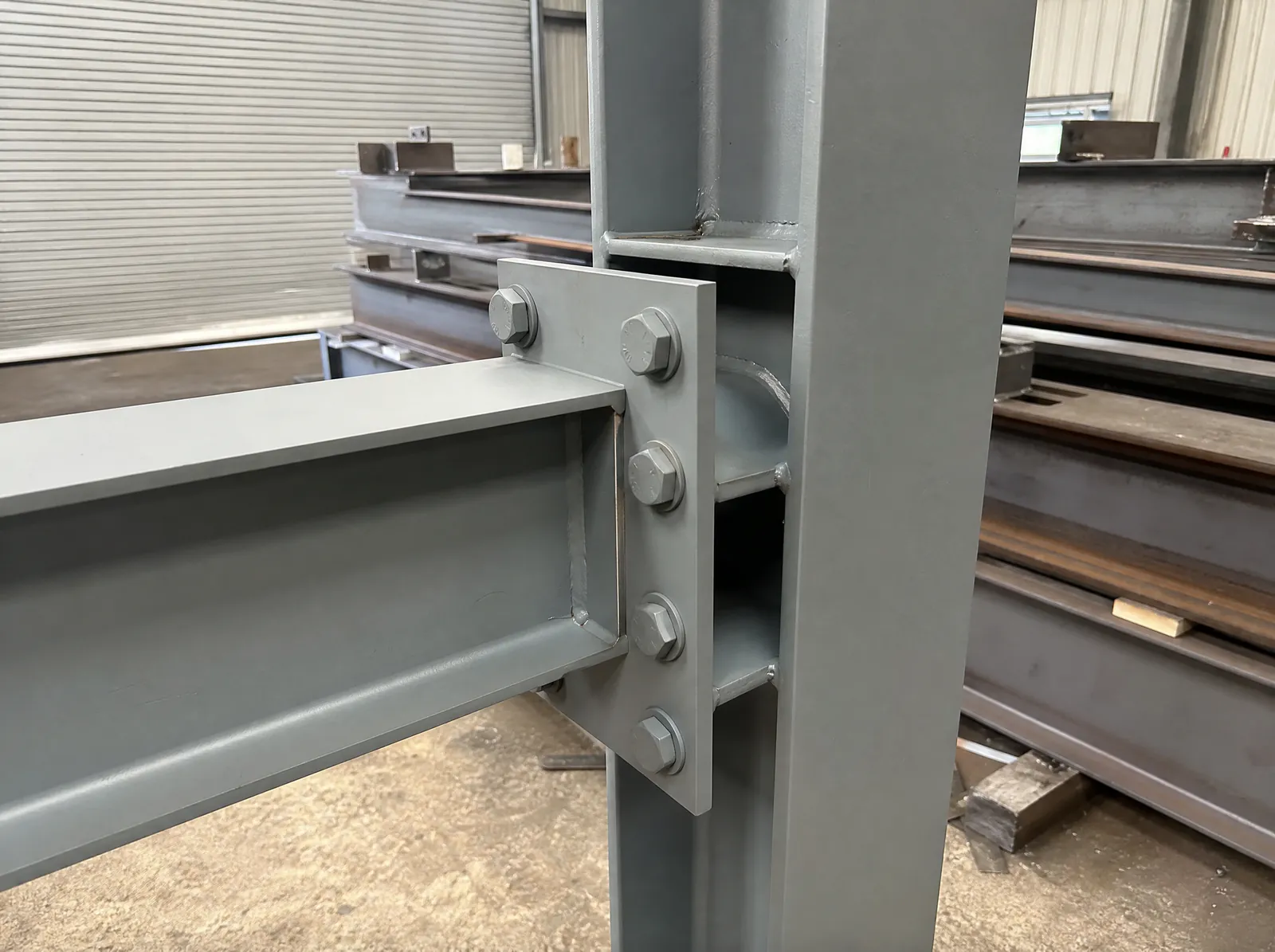Bolted end-plate connection between a steel beam and column in a fabrication workshop