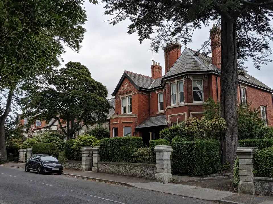 Edwardian red-brick houses on a tree-lined road in Greystones, County Wicklow